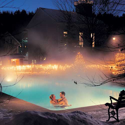 Couple Enjoying Heated Outdoor Pool in the Winter